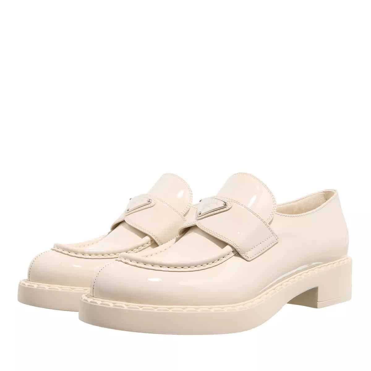 Prada Loafers & ballerina schoenen - Triangle Logo Leather Loafers in crème
