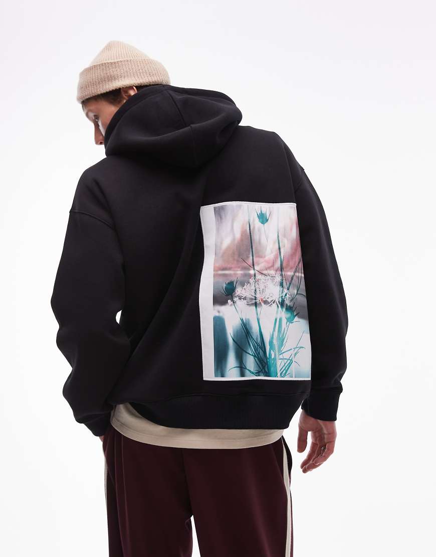 Topman - Oversize-Kapuzenpullover in Schwarz mit Etikett-Blumenprint auf Vorder- und Rückseite
