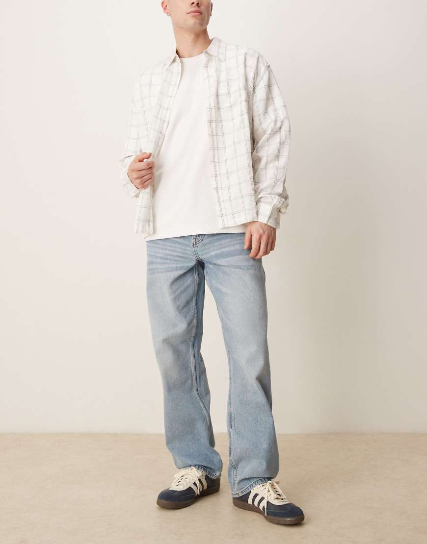 ASOS DESIGN - Weite Jeans in verwaschenem Hellblau