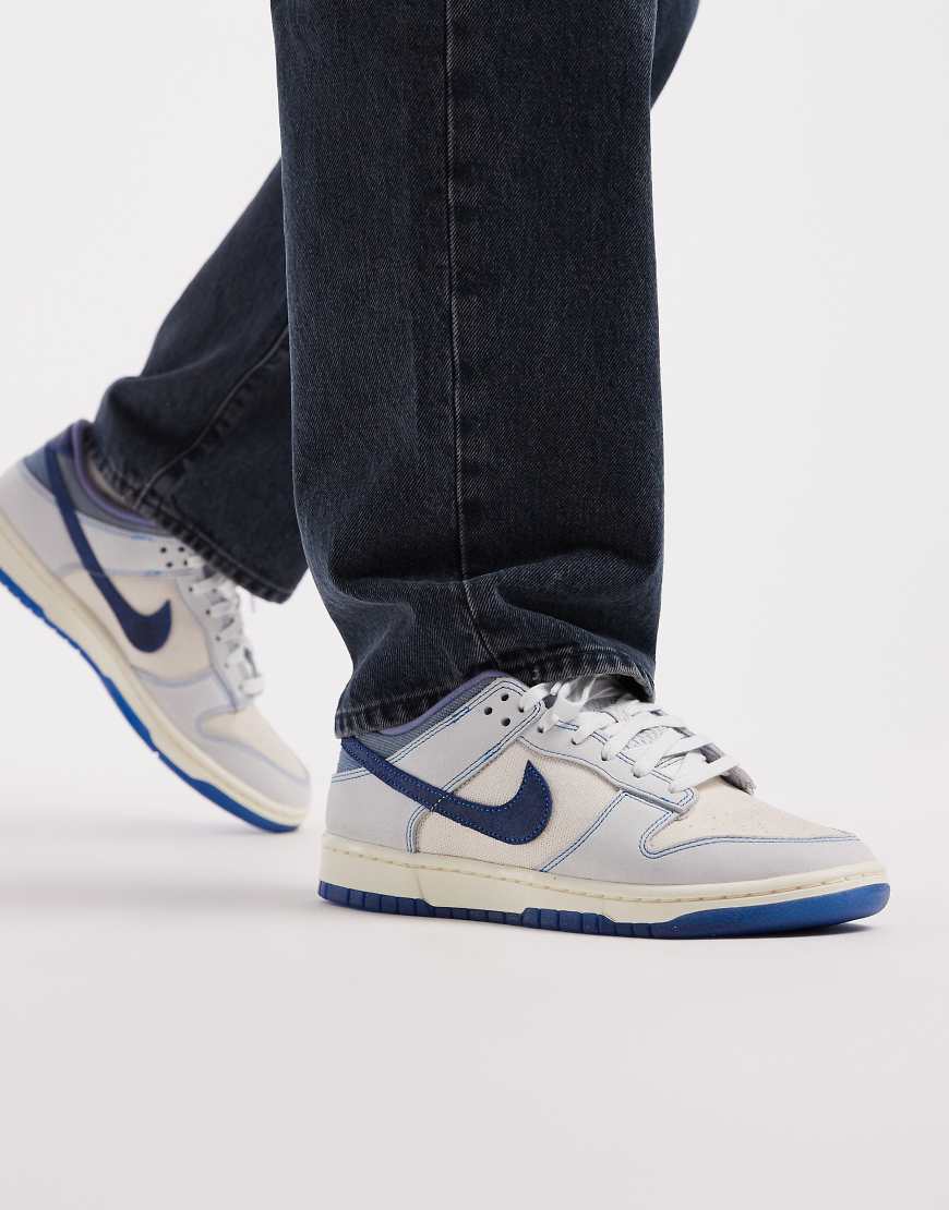 Nike - Dunk Low Retro - Niedrige Sneaker in Wollweiß und Blau