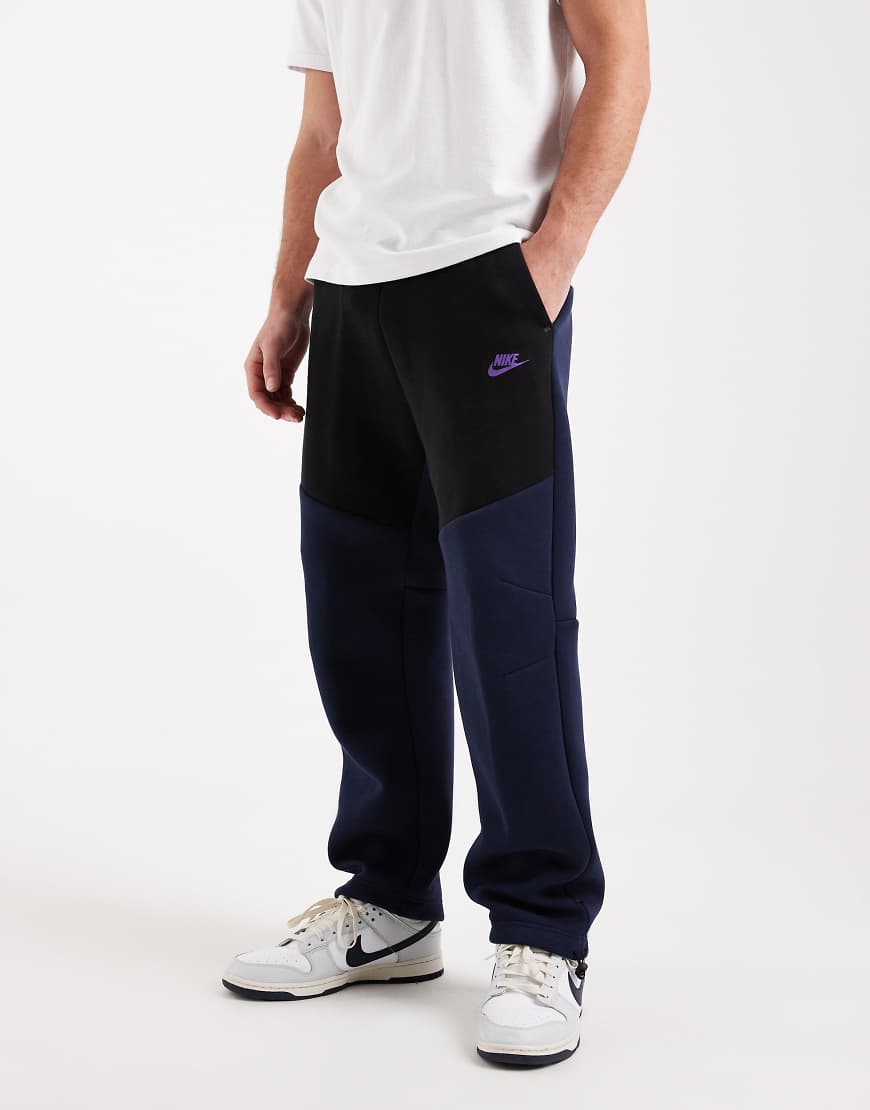Nike - Tech Fleece - Jogginghose in Schwarz und Marineblau mit offenem Saum